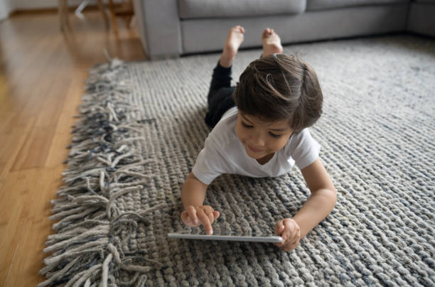 Girl lying on rug | Staff Carpet